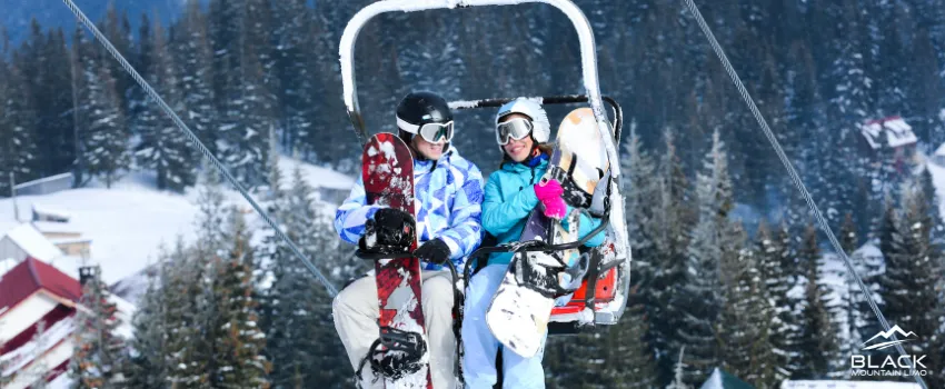 BML - Couple riding a ski lift at a ski resort