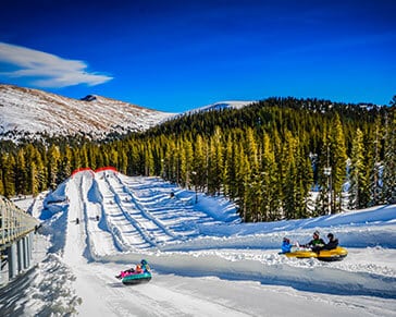 Massive multi-lane snow tubing hill at Keystone Ski Resort in Colorado.